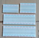 Solderless Breadboard Lot Plug-in Prototype Boards W/ Adhesive Backing White. Fixed Price $10.00.